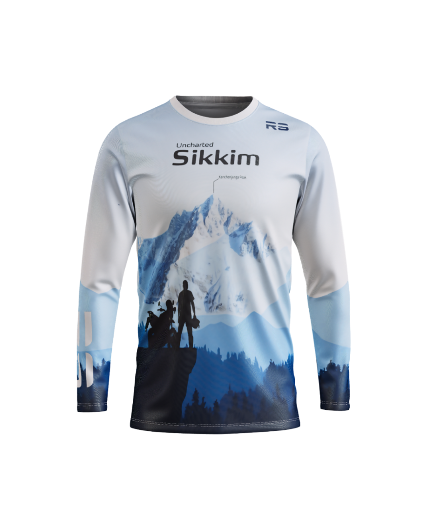 A long-sleeve athletic jersey with a blue and white mountain landscape graphic on the front, featuring the text 'Uncharted Sikkim' and a small 'RS' logo near the collar, shown on a plain white background.