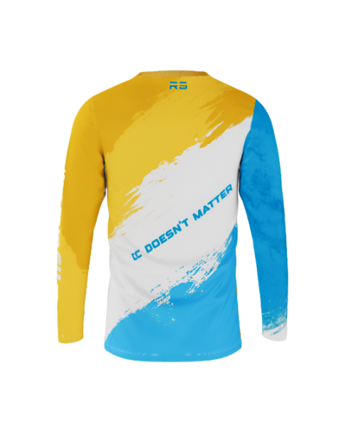 A long-sleeve athletic jersey shown from the back, featuring a bold color-blocked design with yellow on the upper back and sleeves, a large white diagonal brushstroke panel, and light blue on the lower back and right sleeve. The text 'IC DOESN'T MATTER' is printed across the center in blue, with a small 'RS' logo at the collar.
